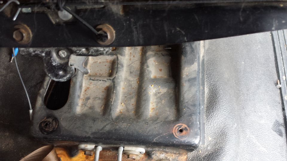 Interior view of seat mounting hardware and floor pan