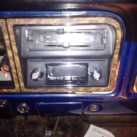 1978 Ford Bronco - Interior view of a 1978 Ford Bronco, woodgrain trim and an aftermarket radio.