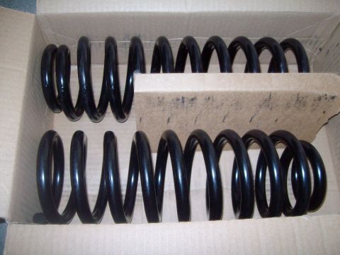 2004 Ford Crown Victoria - New coil springs for sale, packaged in a cardboard box for shipping.