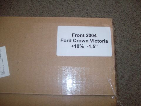 2004 Ford Crown Victoria - A cardboard box is shown with a label indicating it contains parts for a 2004 Ford Crown Victoria.