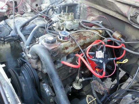 1981 Ford Bronco - Close-up view of a V8 engine compartment, showing various components and wiring.