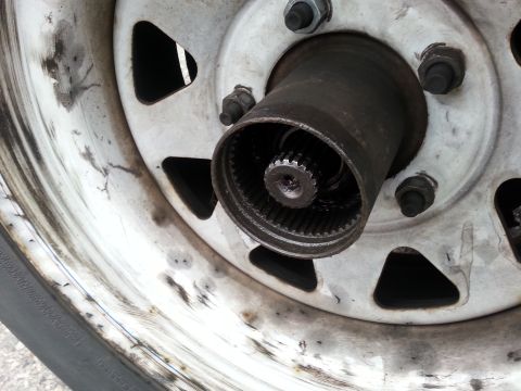 1981 Ford Bronco - This image shows a close-up view of a vehicle's front hub assembly, including the wheel and tire.