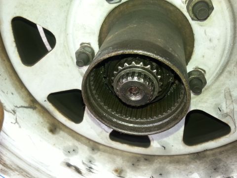1981 Ford Bronco - A detailed view of a Warn Hub assembly, showing its internal gearing and connection to the wheel.
