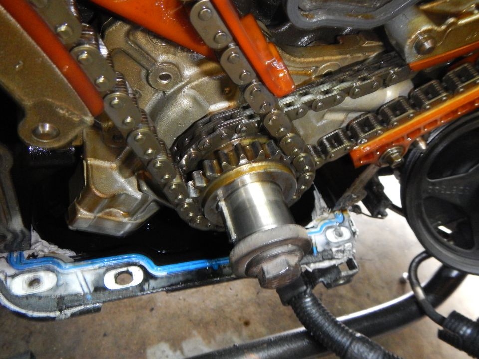 Engine timing chain and gears with orange guides