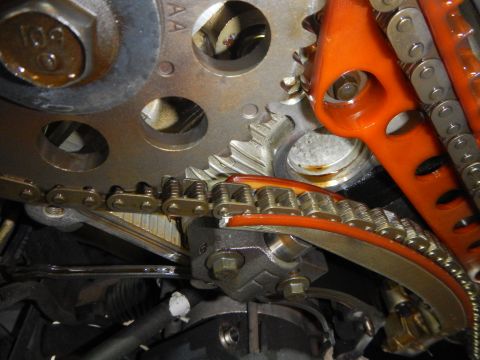 2002 Ford Mustang - This image shows a close-up view of an engine's timing chain and associated gears, likely during maintenance or repair.