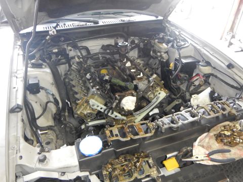 2002 Ford Mustang - Engine bay of a 2002 Ford Mustang during timing chain replacement.