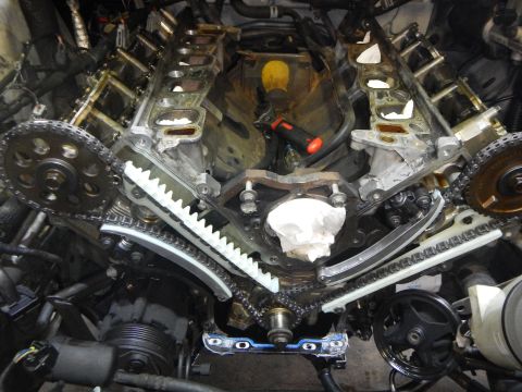 2002 Ford Mustang - Timing chain and guides assembly on a Ford V8 engine during a repair.