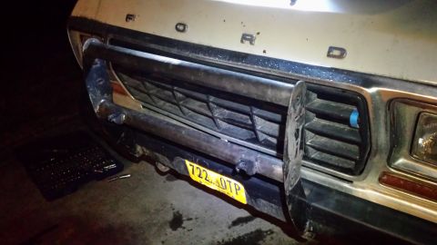 1979 Ford Bronco front grille with bull bar and yellow license plate