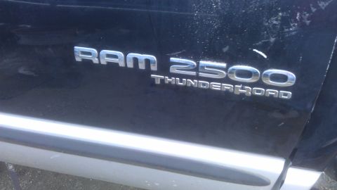 1994 Ford Bronco - Close-up of the Ram 2500 Thunder Road badging on a dark-colored truck.