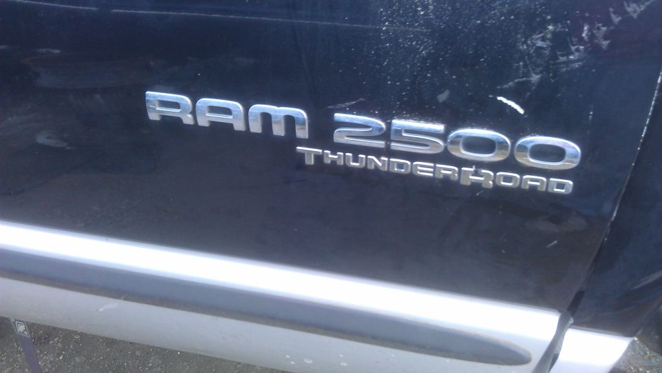 Ram 2500 Thunder Road emblem on black truck door