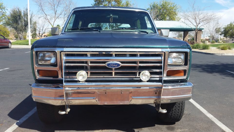 Dark blue 1980 Ford Bronco front view with chrome bumper and grille