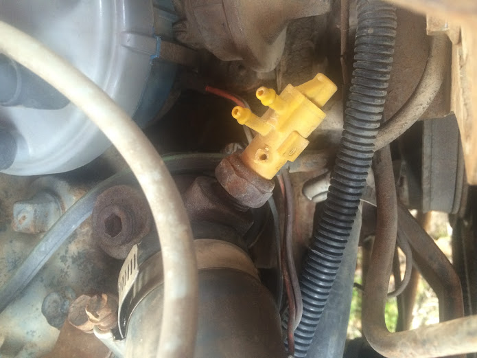 Yellow vacuum line connector with red wire