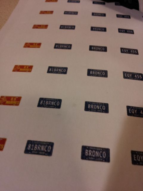 1995 Ford Bronco - A sheet of various decals, including several with 'BRONCO' and '81BRNCO' text, is laid out on a surface.