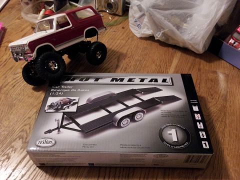 1995 Ford Bronco - A model of a two-tone Bronco sits atop a box for a 1:24 scale car trailer model kit.