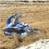 1995 Ford Bronco - A racer tumbles in the dirt during an event.