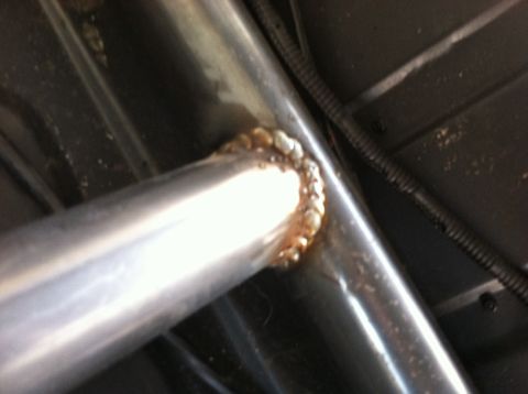 1995 Ford Bronco - Close-up view of welded roll cage tubing, with a Supermotors.net watermark visible.