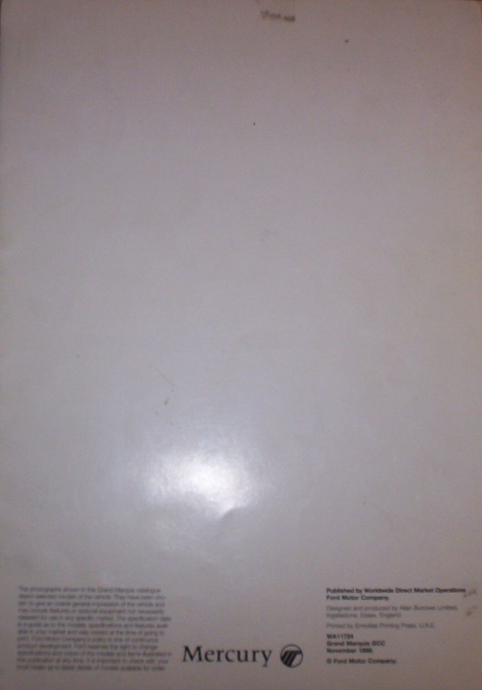 Back cover of Grand Marquis brochure, mostly blank with small print and Mercury logo