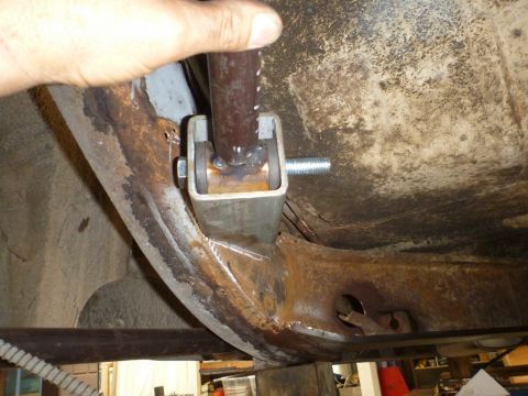 1964 Mercury Monterey - Custom suspension part being installed on a rusty vehicle frame.