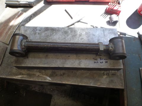 1964 Mercury Monterey - A custom-made suspension control arm is shown on a workbench, with handwritten measurements and notes visible.