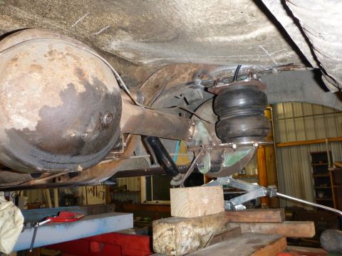1964 Mercury Monterey - Underside view of a vehicle's rear axle and an installed air suspension bag.