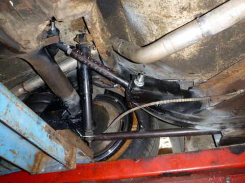 1964 Mercury Monterey - This photo shows the rear suspension system of a vehicle, including the shock absorbers and exhaust.