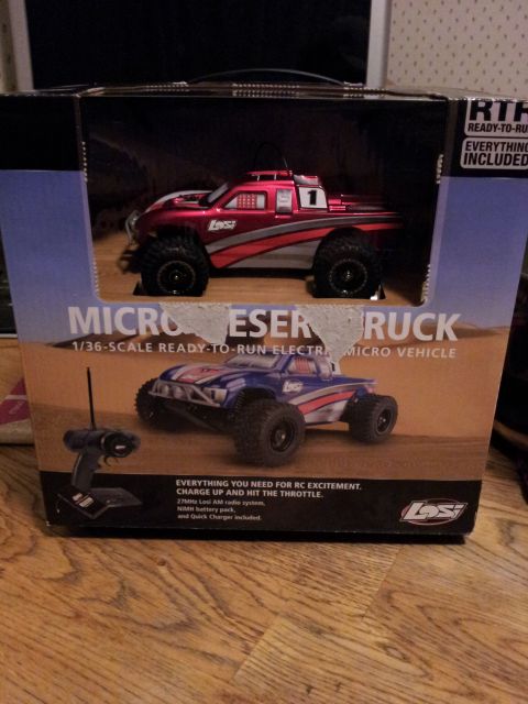 1995 Ford Bronco - Box art displays a red remote control monster truck and a graphic of a blue one, along with a controller.