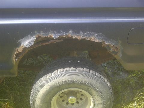 1979 Ford Bronco - Significant rust damage is visible on the rear wheel well of this 1979 Ford Bronco.