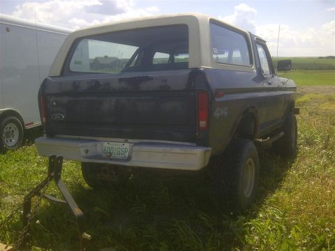 1979 Ford Bronco - Rear view of a 1978 Ford Bronco, showing its boxy body and removable hardtop.