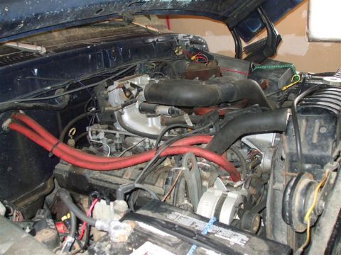 1979 Ford Bronco - The engine bay of a 1979 Ford Bronco, showing the V8 engine and associated components.