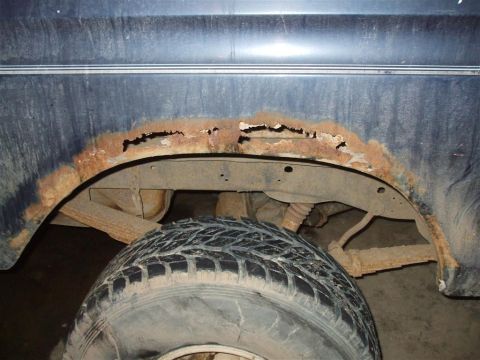 1979 Ford Bronco - Significant rust damage is visible around the wheel arch and on the vehicle's frame.