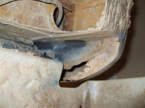 1979 Ford Bronco - Detail of heavily rusted vehicle frame, showing significant corrosion and damage.