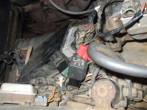 1979 Ford Bronco - Vehicle wiring harness and relays, likely from an engine bay or under the dashboard.