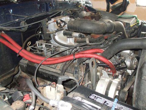 1979 Ford Bronco - Close-up view of a vehicle's engine compartment, showing complex mechanical components and wiring.