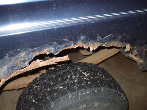 1979 Ford Bronco - Severe rust has compromised the lower body panel of this vehicle, obscuring any specific year identification.