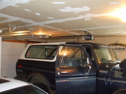 1979 Ford Bronco - This 1979 Ford Bronco is parked inside a garage with its doors open.