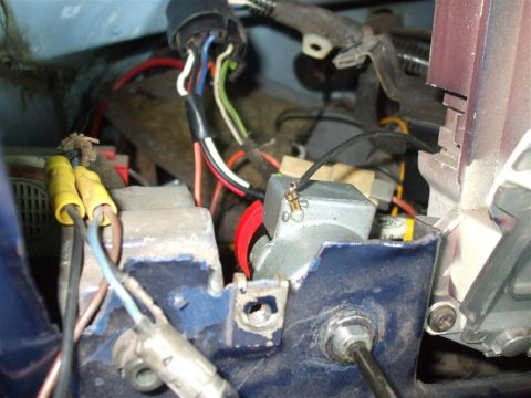 1979 Ford Bronco - A close-up view of a vehicle's complex wiring harness and electrical components.