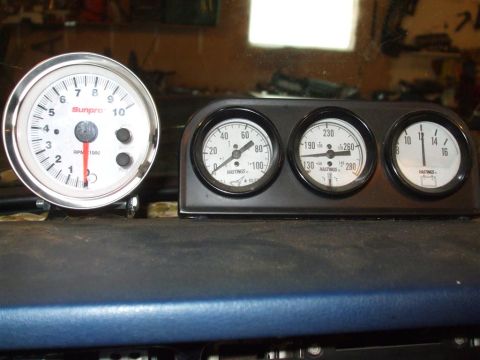 1979 Ford Bronco - Dashboard features a tachometer and three auxiliary gauges for monitoring engine vitals.