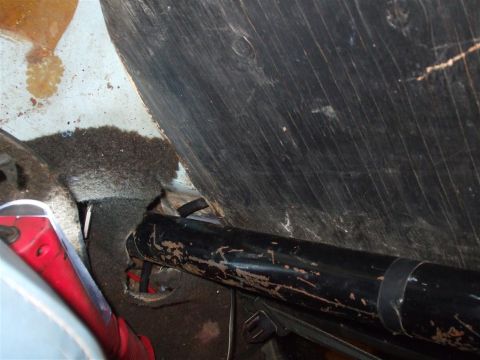 1979 Ford Bronco - Close-up interior shot of a vehicle's driveshaft and surrounding components.