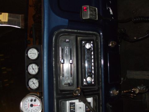 1979 Ford Bronco - The interior of a 1979 Ford Bronco shows a dashboard with multiple gauges and a modern radio installed.