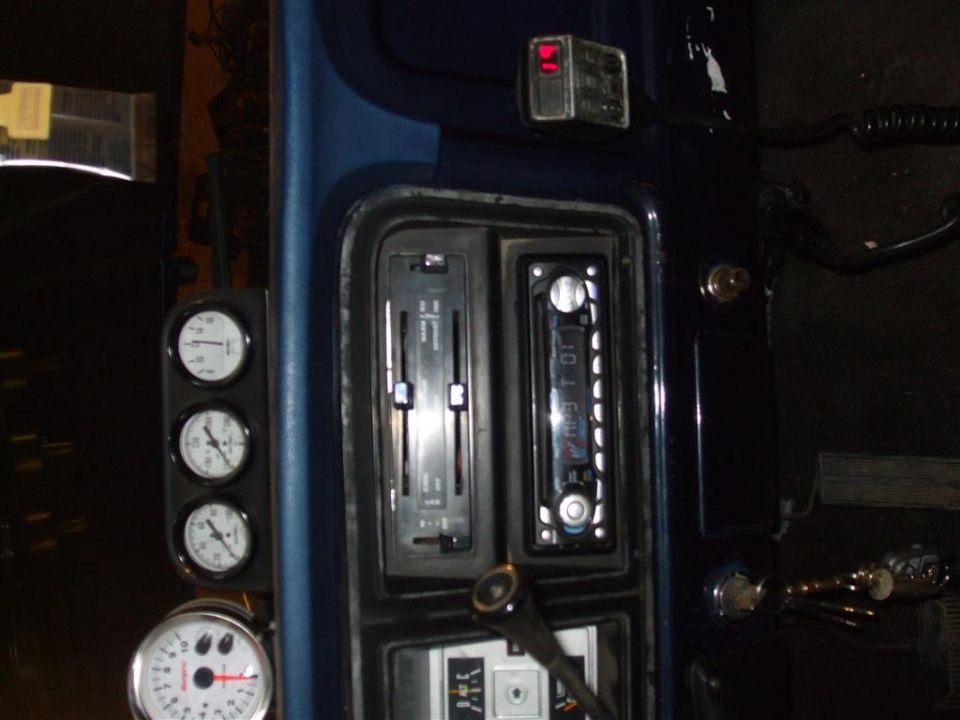 1979 Ford Bronco interior with aftermarket gauges and radio