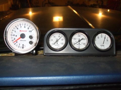 1979 Ford Bronco - Dashboard gauges including a tachometer, oil pressure, water temp, and voltage meters are visible.
