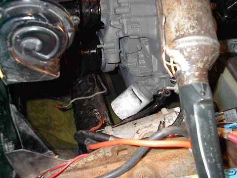 1979 Ford Bronco - Close-up view of the engine compartment, showing mechanical components and wiring.