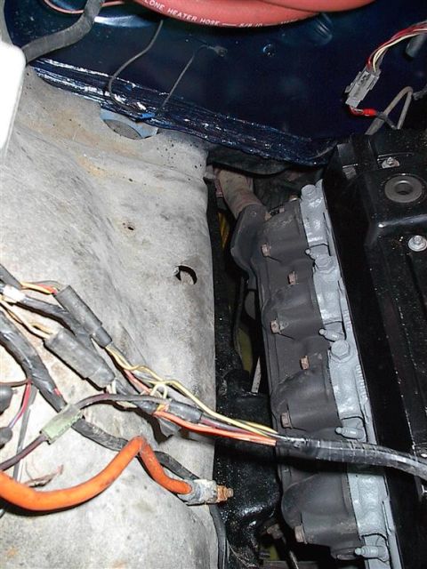 1979 Ford Bronco - Close-up view of engine bay components, including wiring harnesses and hoses, with a watermark for SuperMotors.net.