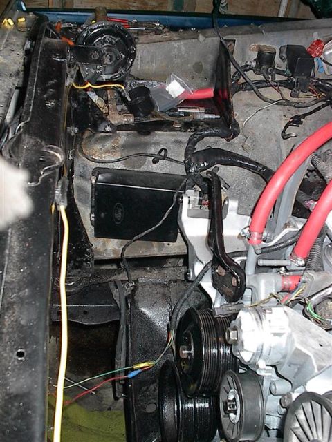 1979 Ford Bronco - Close-up view of the engine bay, showing various electrical wires and mechanical parts.