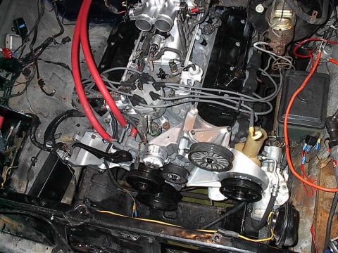 1979 Ford Bronco - Close-up view of a V8 engine bay, showing various components and wiring.