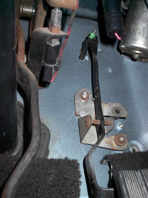 1979 Ford Bronco - Interior view of vehicle pedals and linkage, showing mechanical components and wiring.