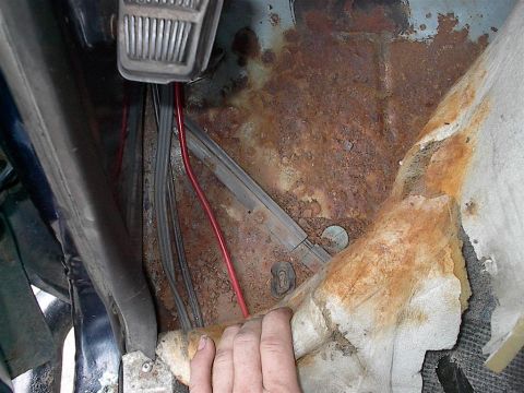 1979 Ford Bronco - Significant rust damage is visible on the floor pan of this vehicle's interior.