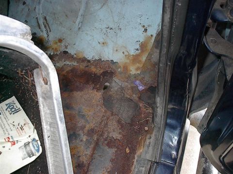 1979 Ford Bronco - Significant rust damage is visible on the interior floor pan of the vehicle.