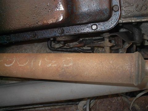 1979 Ford Bronco - Exhaust pipe with white writing that appears to say "BRONCO".