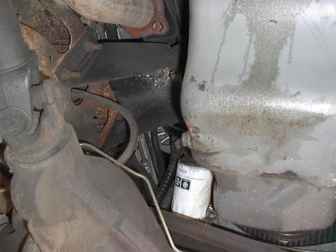 1979 Ford Bronco - Underside view of engine components, including an oil filter.